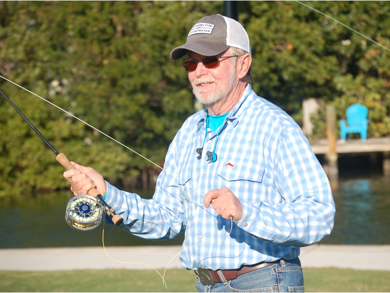 Photo of Rusty Chinnis casting a fly.