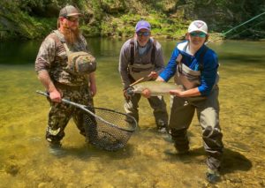 David Schulhofer, 16, shows off his catch with guide Zack Chapman, left, and the author. - Rusty Chinnis | Sun