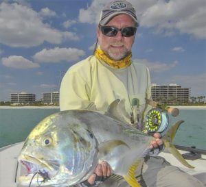 Capt. Rick Grassett with a large jack crevalle he landed while tarpon fishing off Longboat Key. - Rusty Chinnis | Sun